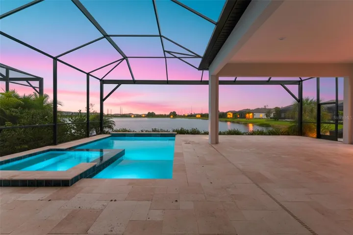 Evenings feel magical with the pool glowing and sunset colors reflecting over the water—an ideal setting for winding down or hosting friends.