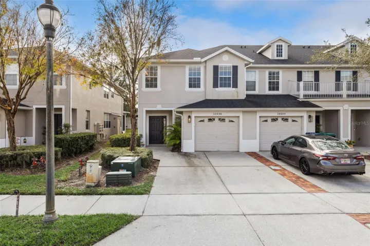 Side view of end unit townhome with 11 extra windows allowing ample natural light.