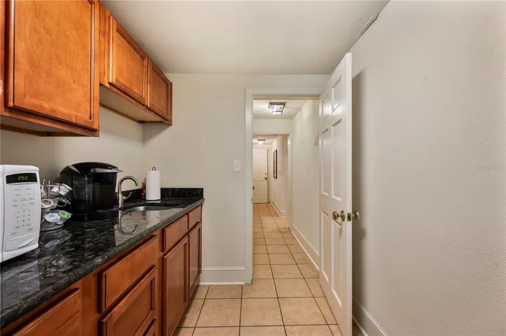 Exiting the kitchen , are both the ladies and Mens rest rooms