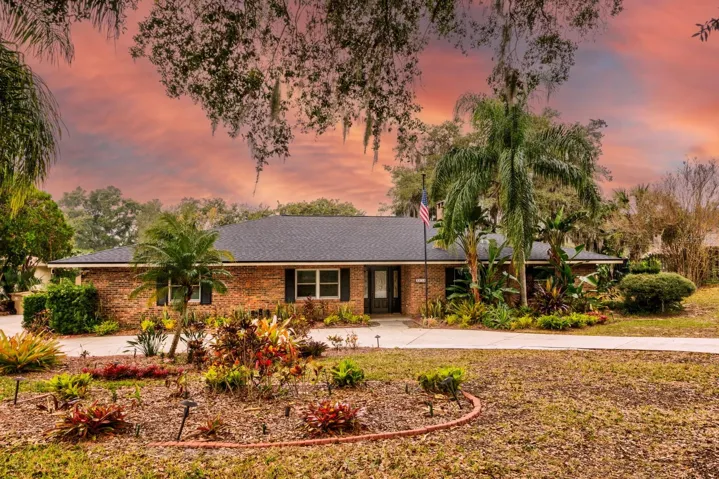 Front of home with circular driveway