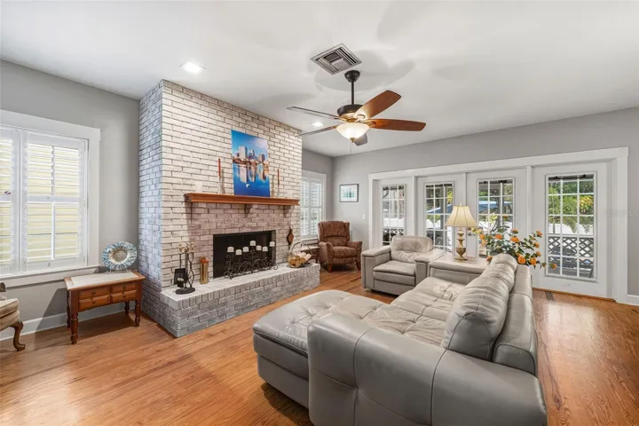Living room with wood burning fire place