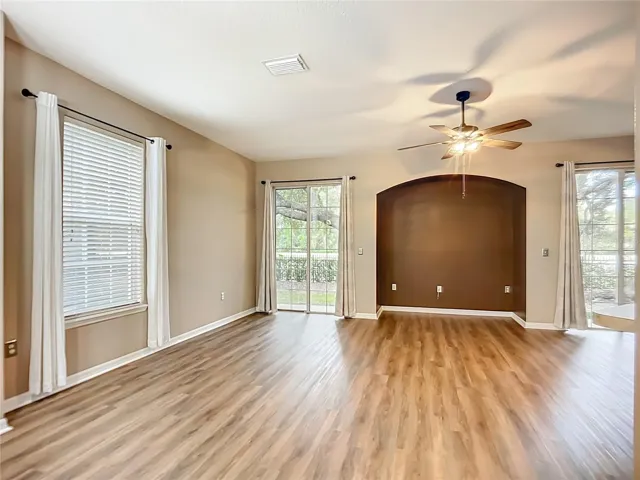Spacious living room with dual slider doors.