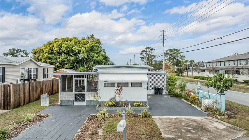 Front Exterior, 2 bedrooms, 2 covered patio areas, 55+ community - Double Driveway