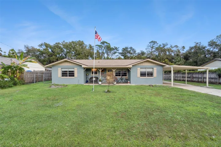 One story ranch with carport and detached LARGE garage/workshop