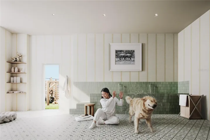 Pet-friendly living at its finest - dedicated dog wash station designed for convenience and care, openng directly to the dog run area for easy access after outdoor play.