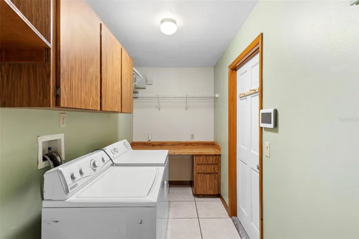 Laundry room with door to garage