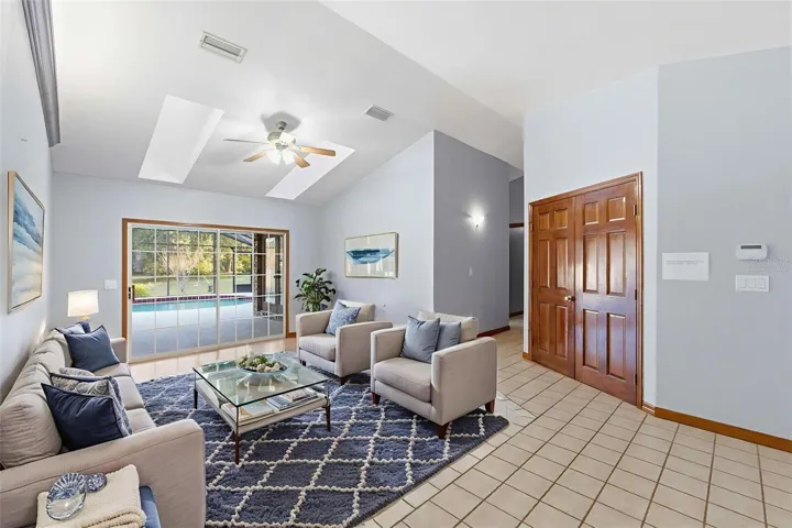 Living Room Virtually Staged looking out at pool