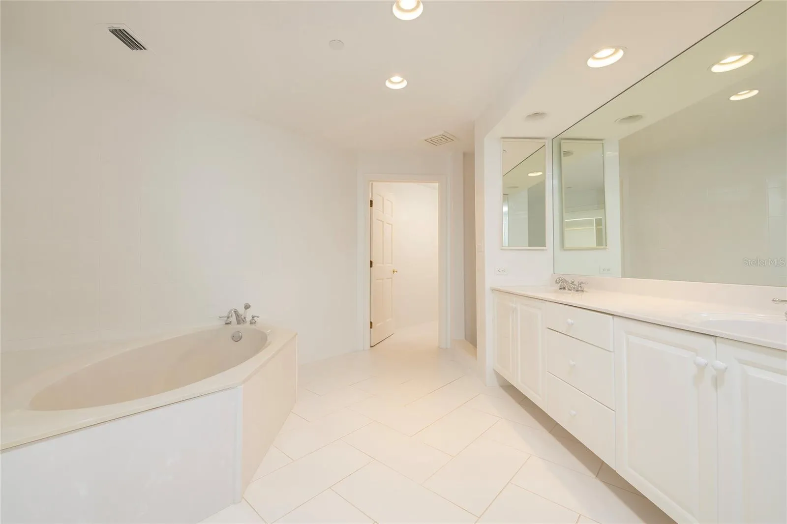 Master Bathroom with soaking tub, separate shower, dual vanities and separate water closet