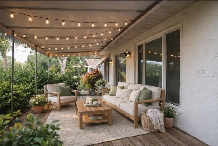 virtually staged patio with privacy hedge