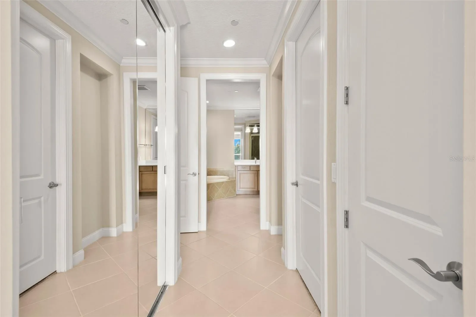 Walking from Main Bedroom to Owner's Bath.