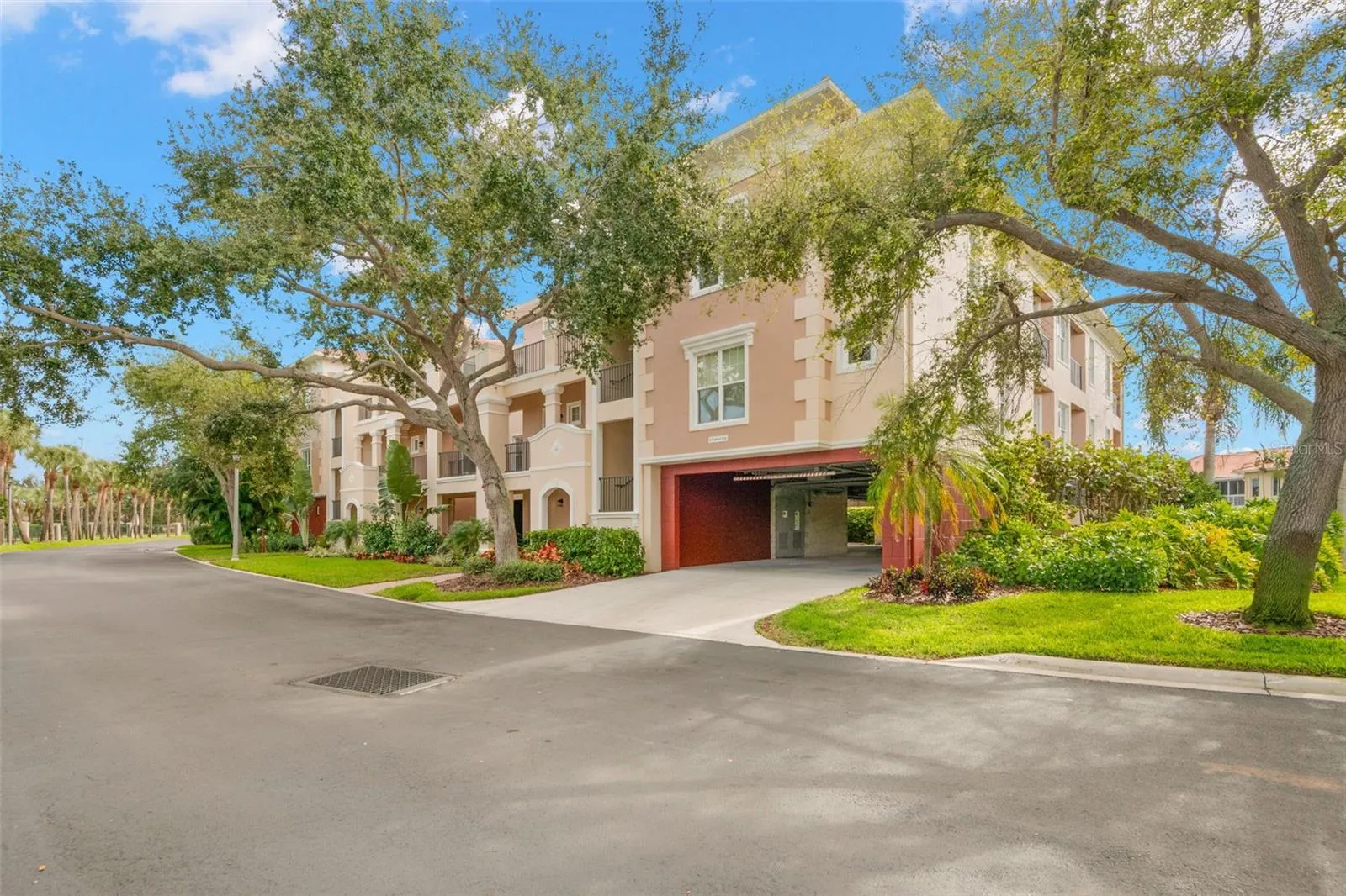 Front of building showing garage access where each of the 8-units in the building have two, deeded parking spaces that are well protected from the sun and weather elements.