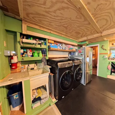 Laundry area converted garage unit