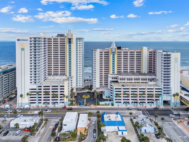 Aerial view of Wyndham Ocean Walk showcasing its premier oceanfront location and iconic twin-tower presence along Daytona Beach’s famous shoreline.