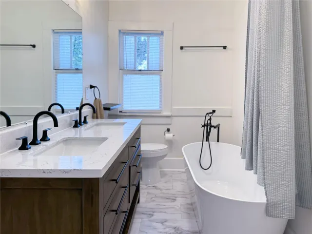 Double sink vanity and tub