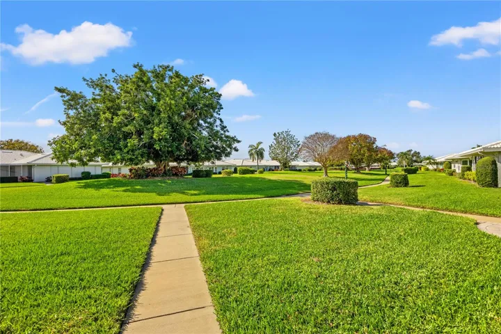 Step outside your back door and follow the side walk to the gated community heated pool, shuffleboard and activities in the social gathering area.