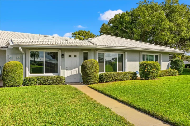 Step outside your back door and follow the side walk to the gated community heated pool, shuffleboard and activities in the social gathering area.
