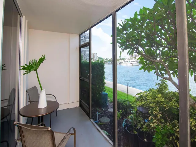 Exterior back, screened patio to water view
