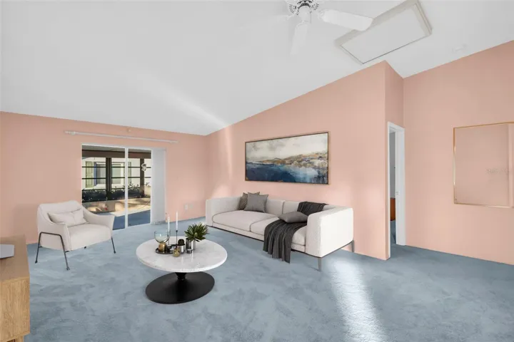 Main living opens to fully enclosed lanai with separate AC wall unit making the perfect office/craft room or bonus year-roud retreat~