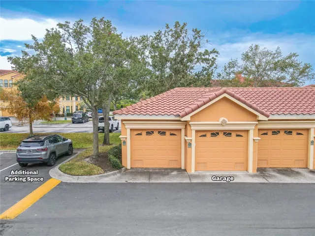 Deeded private garage and 1 assigned parking spot, as noted in the photo, just across from the second floor condo unit.
