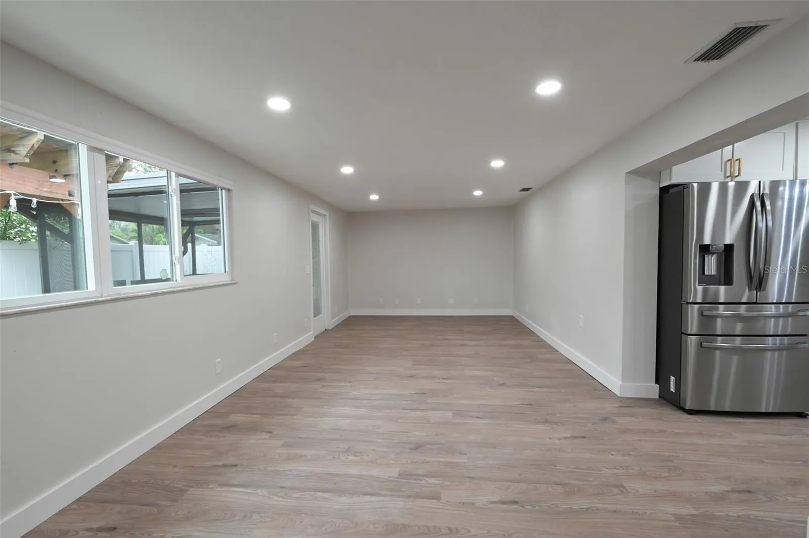 Large family room off kitchen.  French doors out to lanai.
