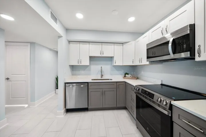 Contemporary finishes lend to the sleek lines of this very attractive property.