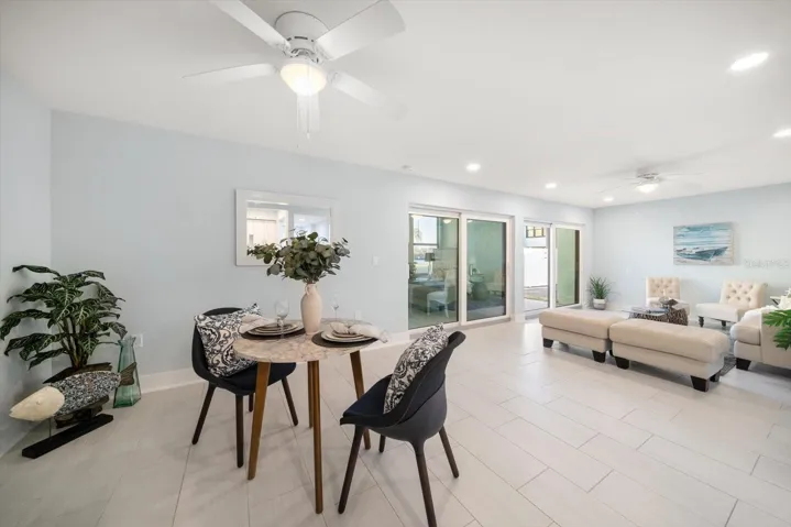 Great room and enclosed lanai overlook the grounds and intracoastal.