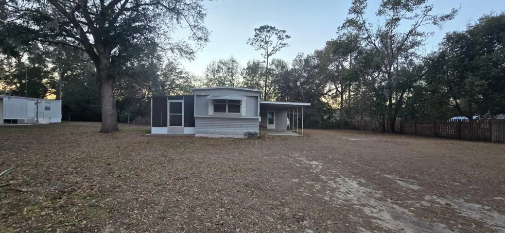 Home view from street with over 1/3 of an acre