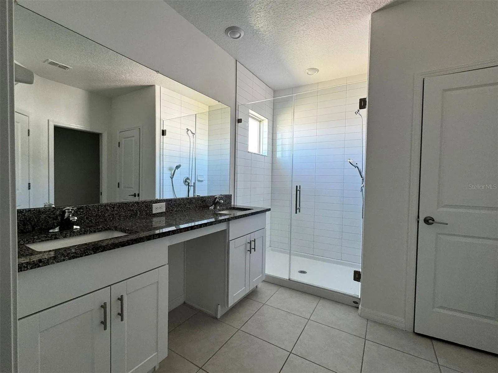 primary en suite bath with dual vanity