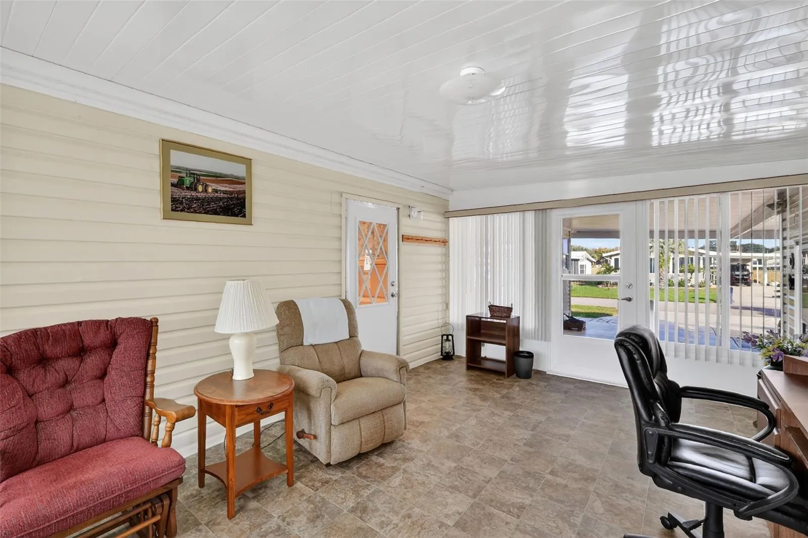 View of Florida Room/Family Room/Office Space looking out to the carport