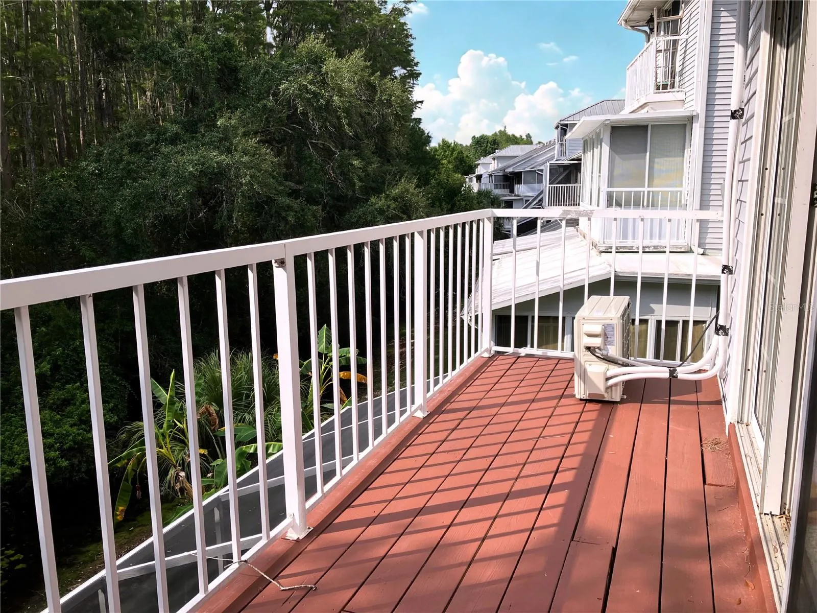 Multiple balconies to see the beautiful preserve. Owner added a second AC system on third floor in primary bedroom.