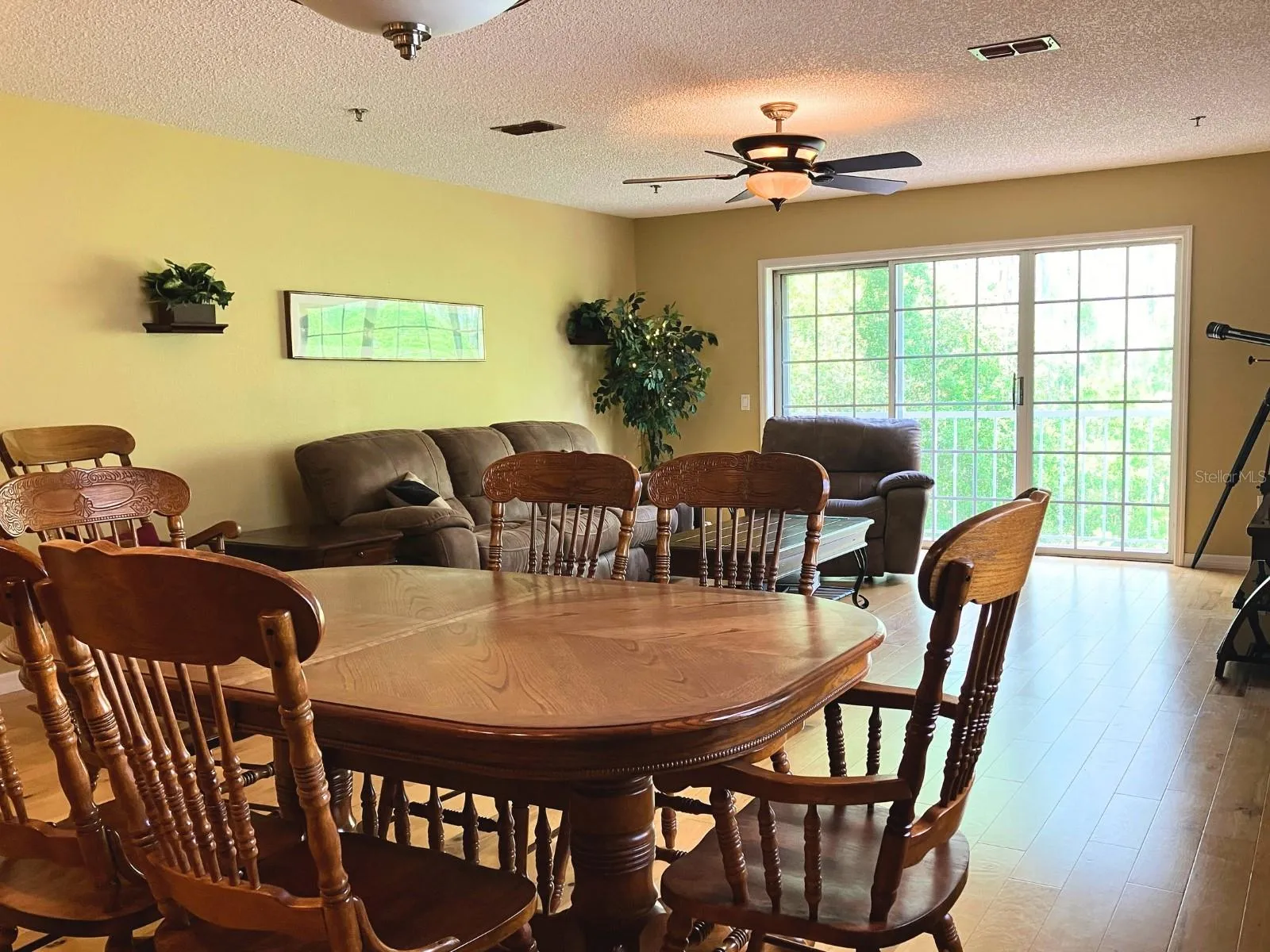 Sliding glass doors in bonus room leads out to the balcony that faces West.
