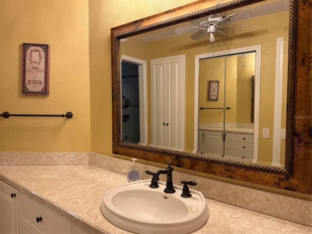 Primary bathroom ensuite has a linen closet and a walk in closet with access to the attic.
