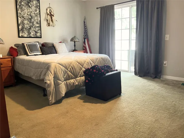 bedroom with balcony faces East with a view of the resort.