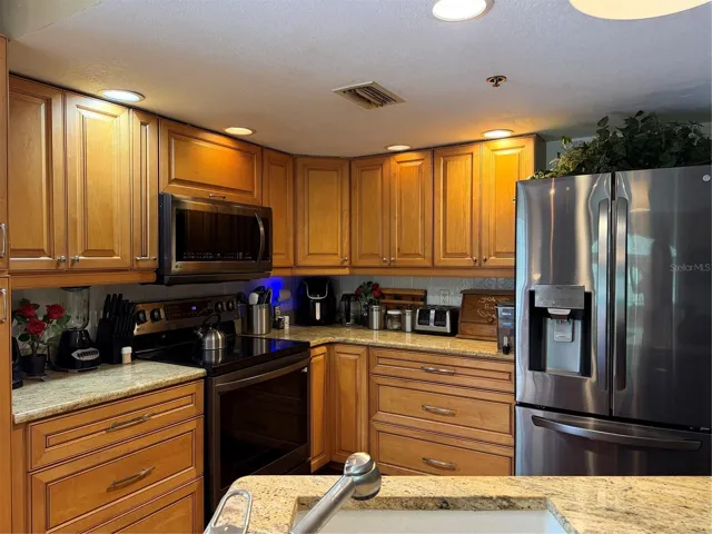 The kitchen cabinets are very nice. Appliances replaced in 2022. LG Refrigerator.