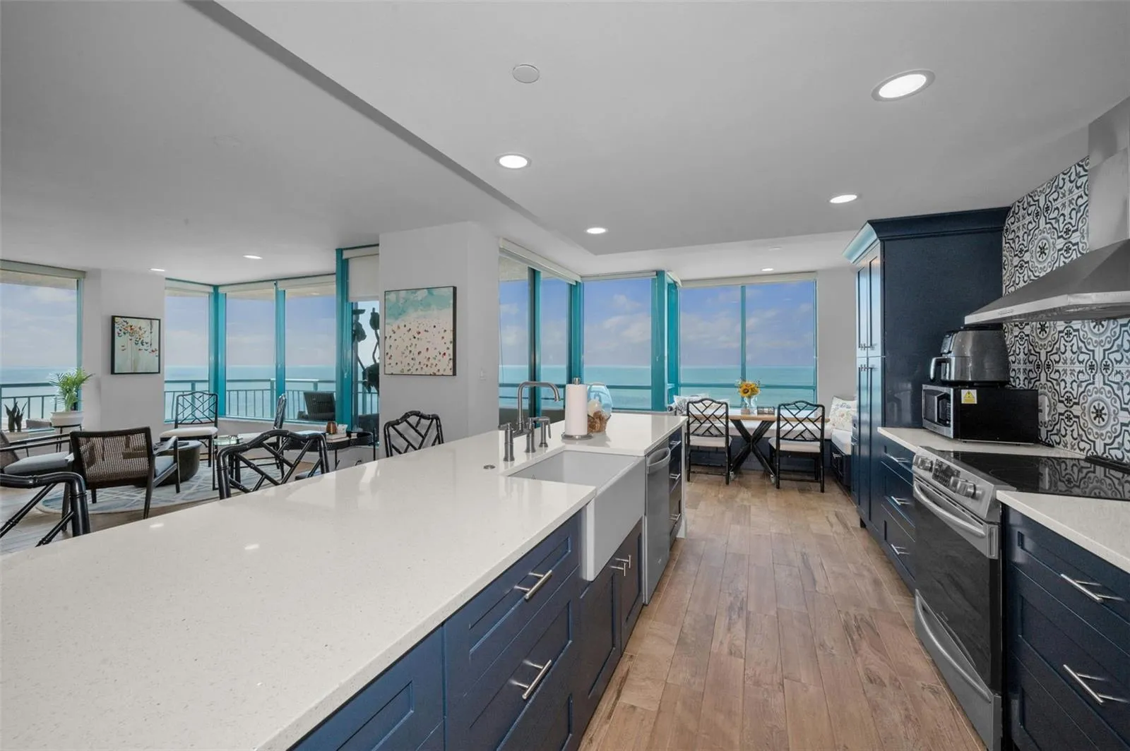 Cucina Features Versay Grand Blue Encaustic Style Porcelain Tile Backsplash, Stainless appliances, Quartz Counter Surfaces, Custom Shaker Style Cabinetry, Farmhouse Apron Front Sink &amp; more.
