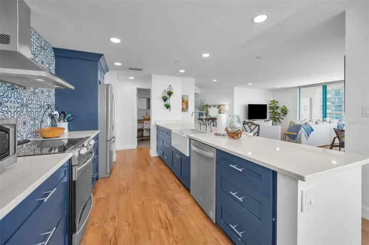Cucina Features Versay Grand Blue Encaustic Style Porcelain Tile Backsplash, Stainless appliances, Quartz Counter Surfaces, Custom Shaker Style Cabinetry, Farmhouse Apron Front Sink & more.