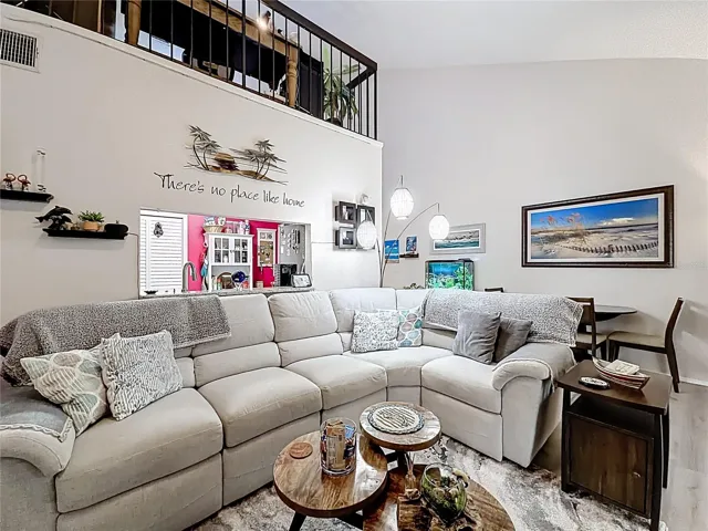 502 Bough Ave - living area, view toward dining, loft above
