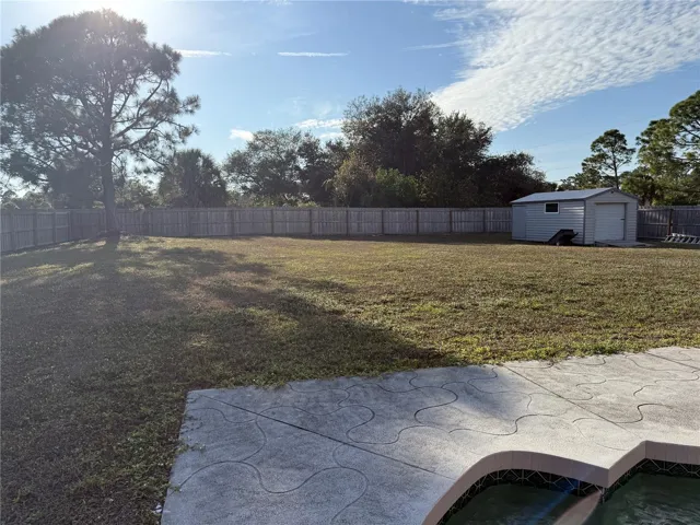 View of yard from pool deck