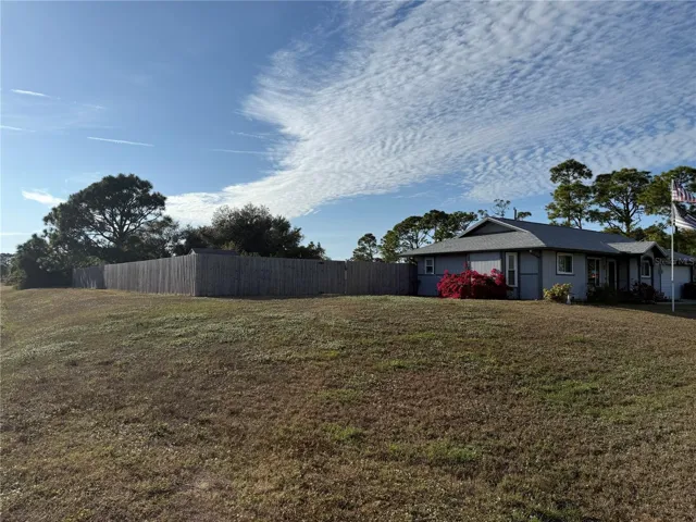 View from left side.   Entire 2nd lot is fenced