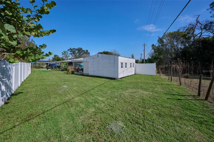 Large lot provides additional space beyond the fencing