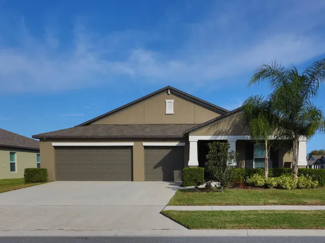 Front of the home with a 3 car garage.