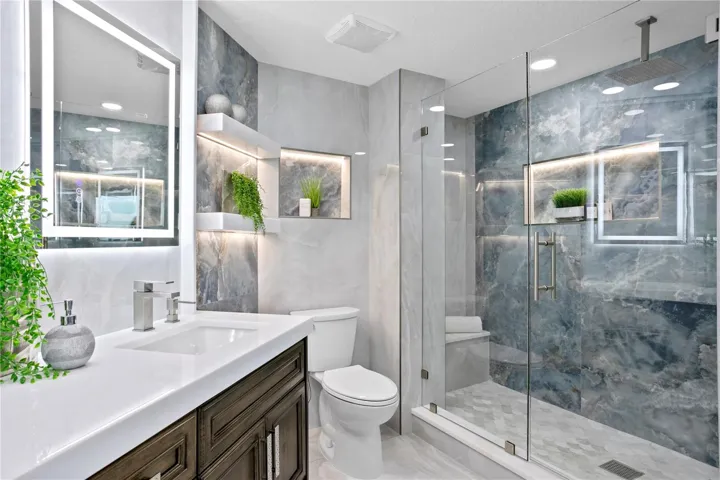 Stunning Primary Bathroom with Mirrored Lighting