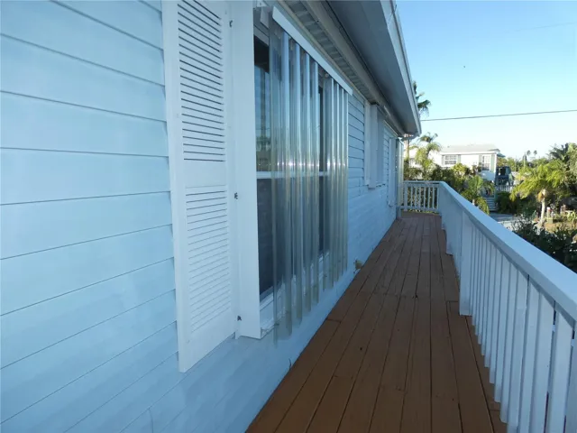 Storm shutters and side entrance.
