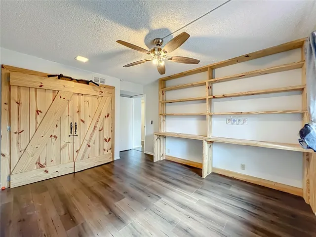 2nd Bedroom with custom Built Shelvings and Closet.