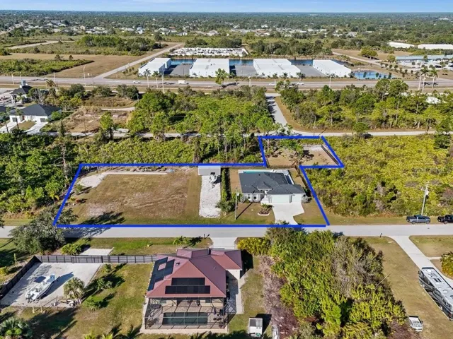 Approximate Outline of entire 3 adjacent lot with home and Driveway to Shed, plus addtional lot behind with partial aluminum fence.