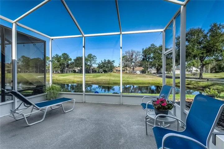 Lanai with view of the pond and golf course