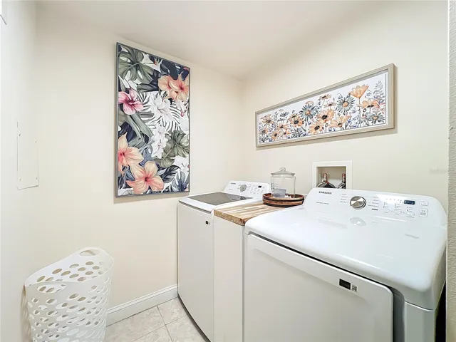 Laundry room with washer and dryer and separate closet