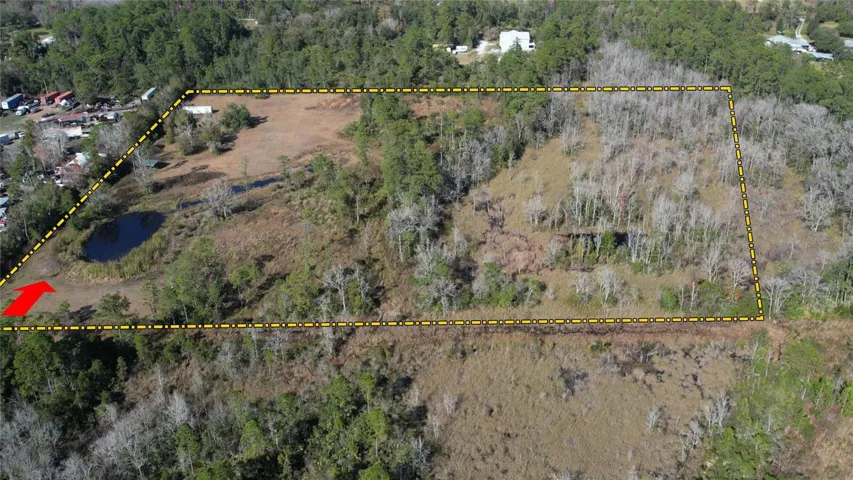 Land has a several Large Pond on it and, of course, NO HOA…just like Everyone Wants! Low, Low Property Taxes only $1711 a year make a long-term hold Affordable! Your Driveway would go down the left side of the pond to the large already-cleared Field in the upper Left of the picture.