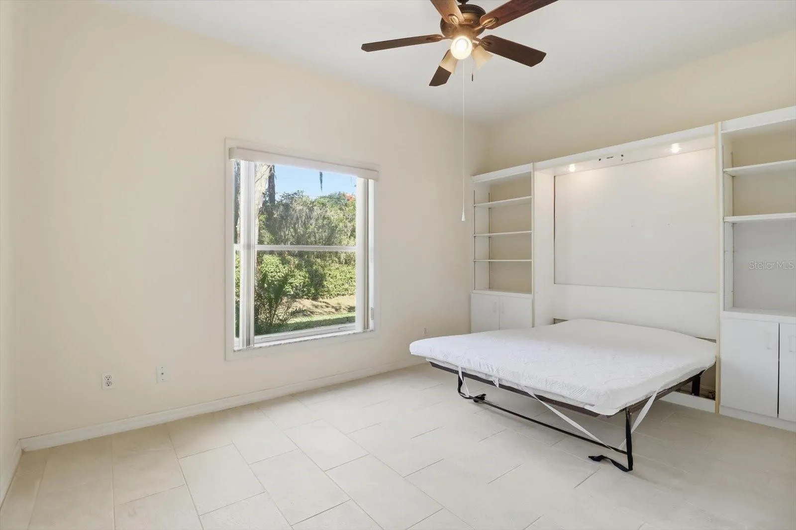 Guest Bedroom w/ Fold Down Murphy Bed & Built-in Bookcases