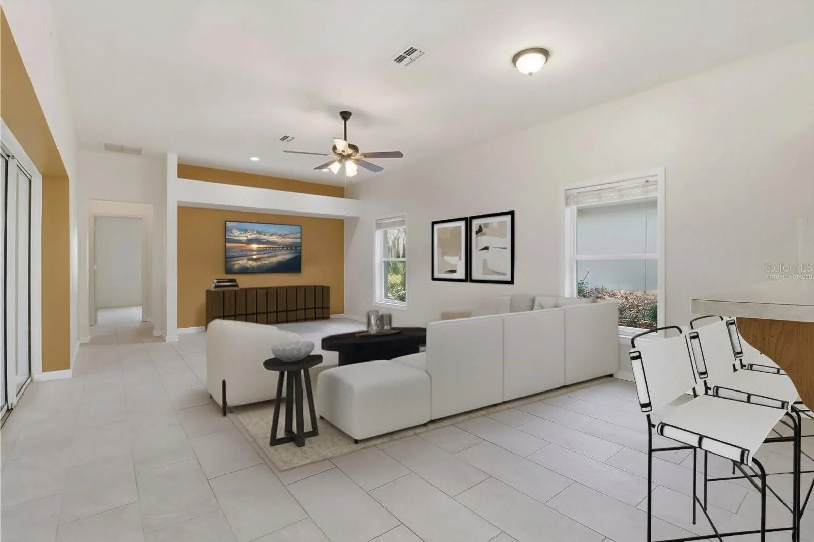 Living Room w/ Full Wall of Pocket Sliders that Open to the Sunroom & Screened Atrium...Virtually Staged